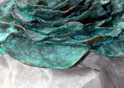 Rose bronze blue patinated on alabaster