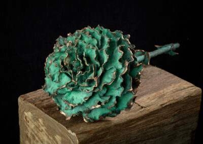 Carnation bronze green patinated